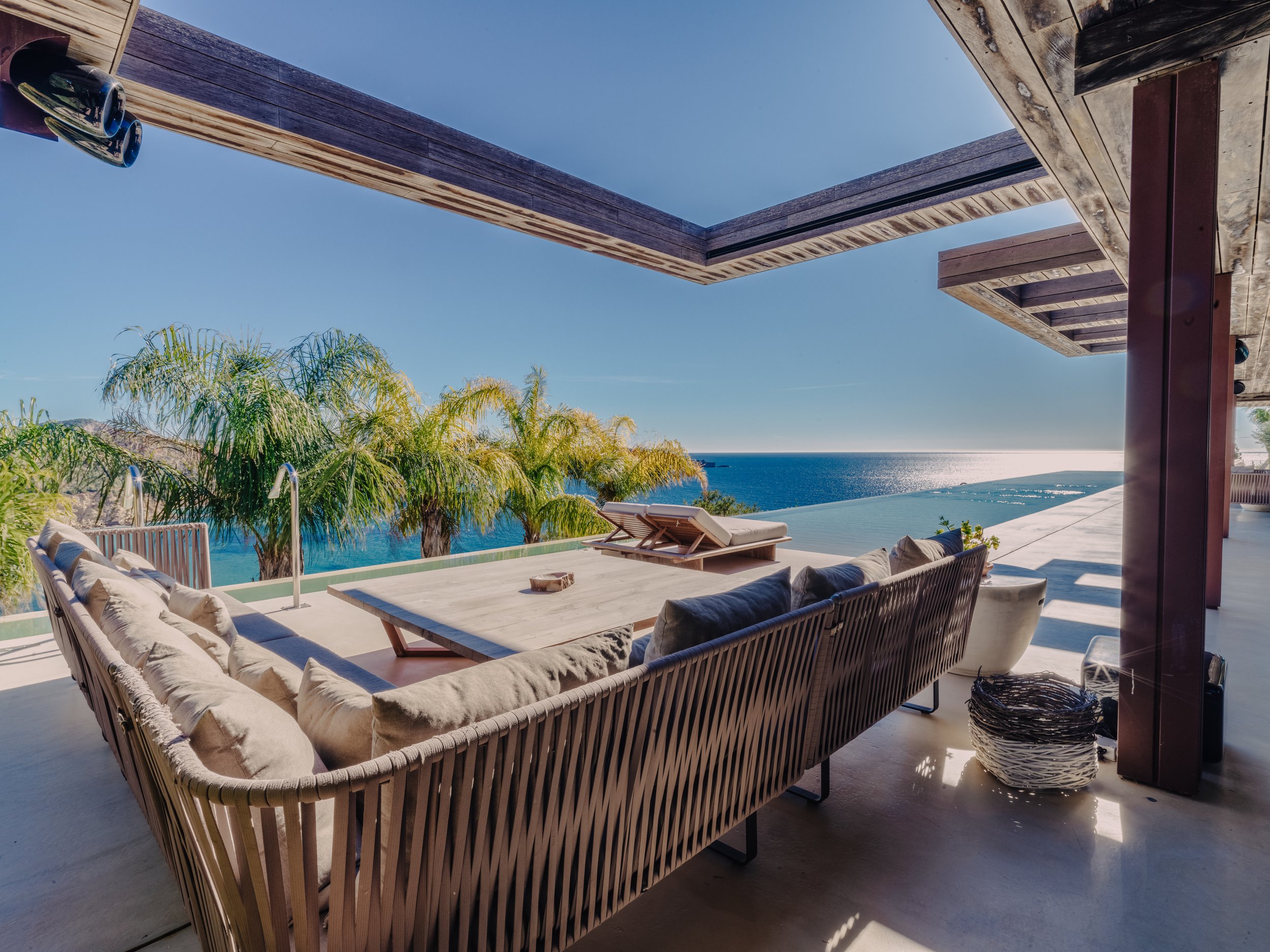 Villa terrace with infinity pool overlooking the sea